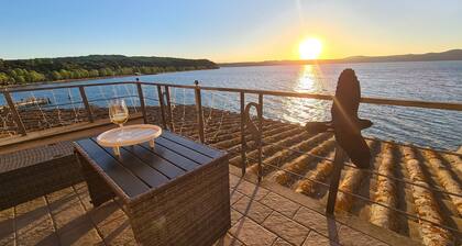 Two-room apartment located in private area of the village with exclusive terrace overlooking the lake