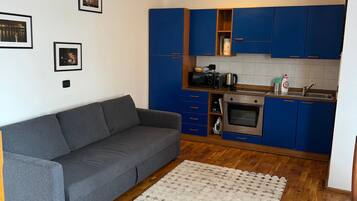 Apartamento | Área de estar | TV