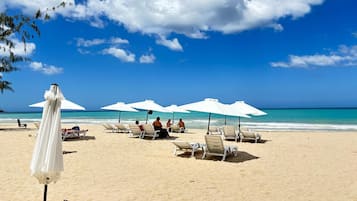 Beach nearby, white sand, sun loungers, beach umbrellas