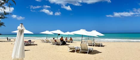 Beach nearby, white sand, sun loungers, beach umbrellas