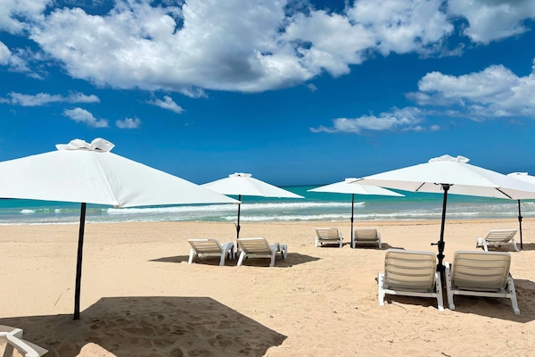 Beach nearby, white sand, sun-loungers, beach umbrellas