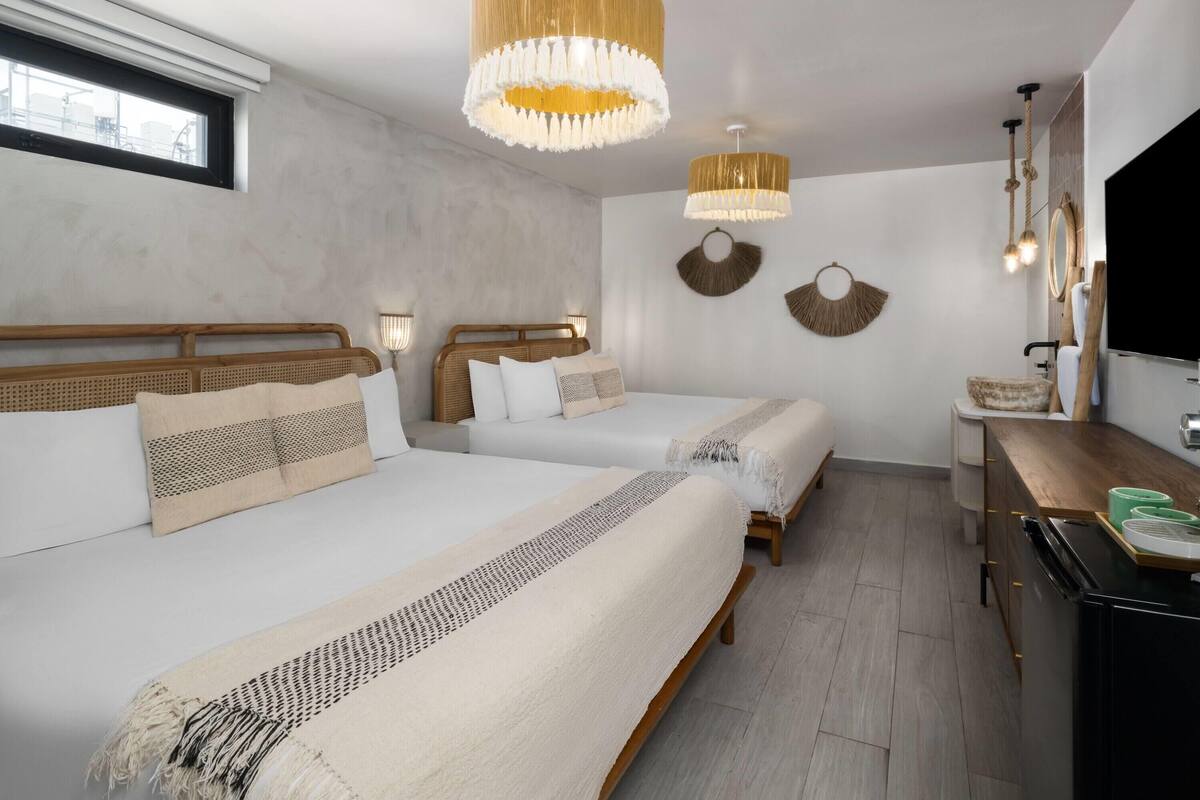 Standard Room, 2 Queen Beds, Non Smoking | Minibar, in-room safe, WiFi (free), individually decorated