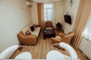 Apartemen Kota | Area keluarga | TV layar datar