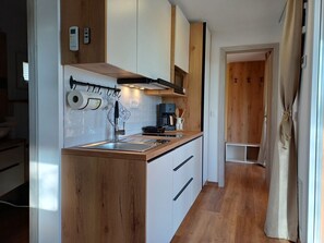 Fridge, microwave, stovetop, coffee/tea maker