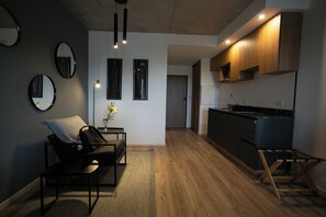 Studio, 2 Einzelbetten | Wohnbereich