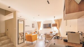A modern living room with a staircase, a dining area, and a kitchen. - Magnifique 6 Personnes Avec Terasse Tropezienne Refait à Neuf (Bandol)