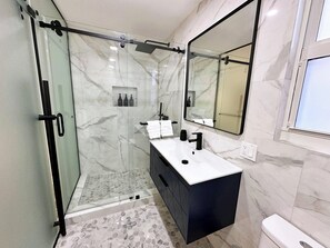 Shower, hair dryer, towels, soap