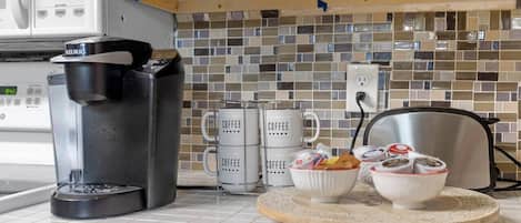 Fridge, coffee/tea maker, toaster, cookware/dishes/utensils