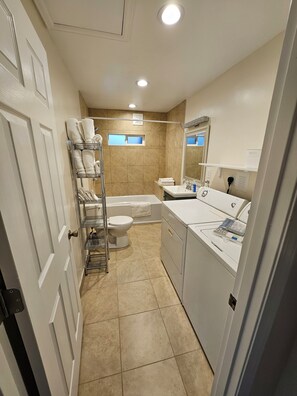 Hair dryer, towels, shampoo, toilet paper