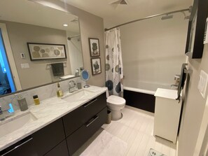 Shower, hair dryer, towels, soap - Luxury 2 bedroom,  2 bath condo in the beautiful west end of downtown Calgary.  (Calgary)