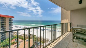 A balcony with a view of a beach and ocean. - Summerhouse 1012c (Panama City Beach)