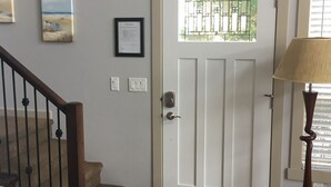 A staircase leading to a door with a frosted glass window.