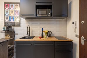 Fridge, microwave, stovetop, coffee/tea maker