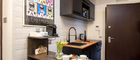 Fridge, microwave, stovetop, coffee/tea maker