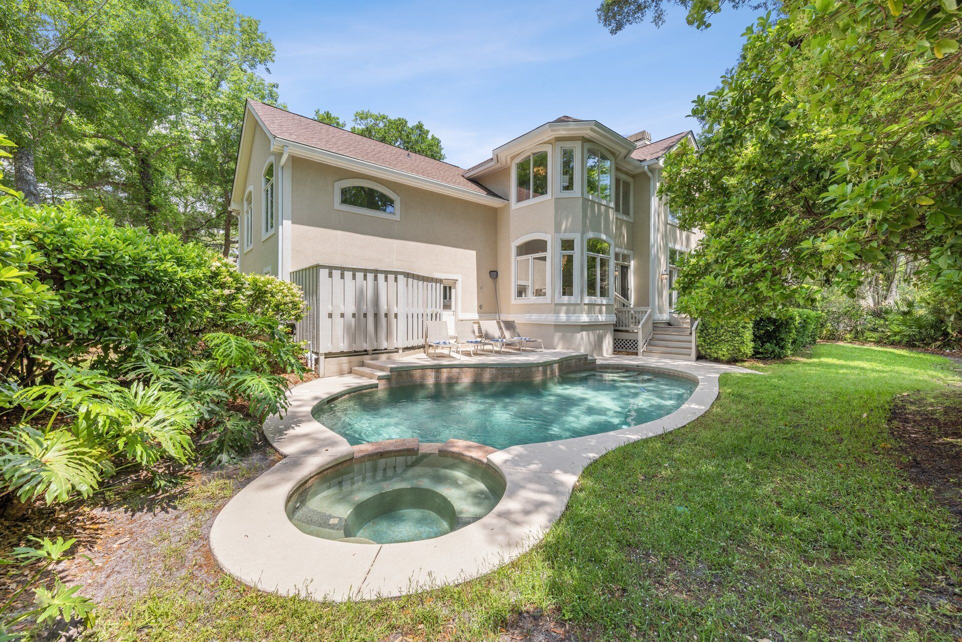 The highlight of this home is its private yard. At its heart lies a pool and splash-down spa, perfect for unwinding or fun water activities.