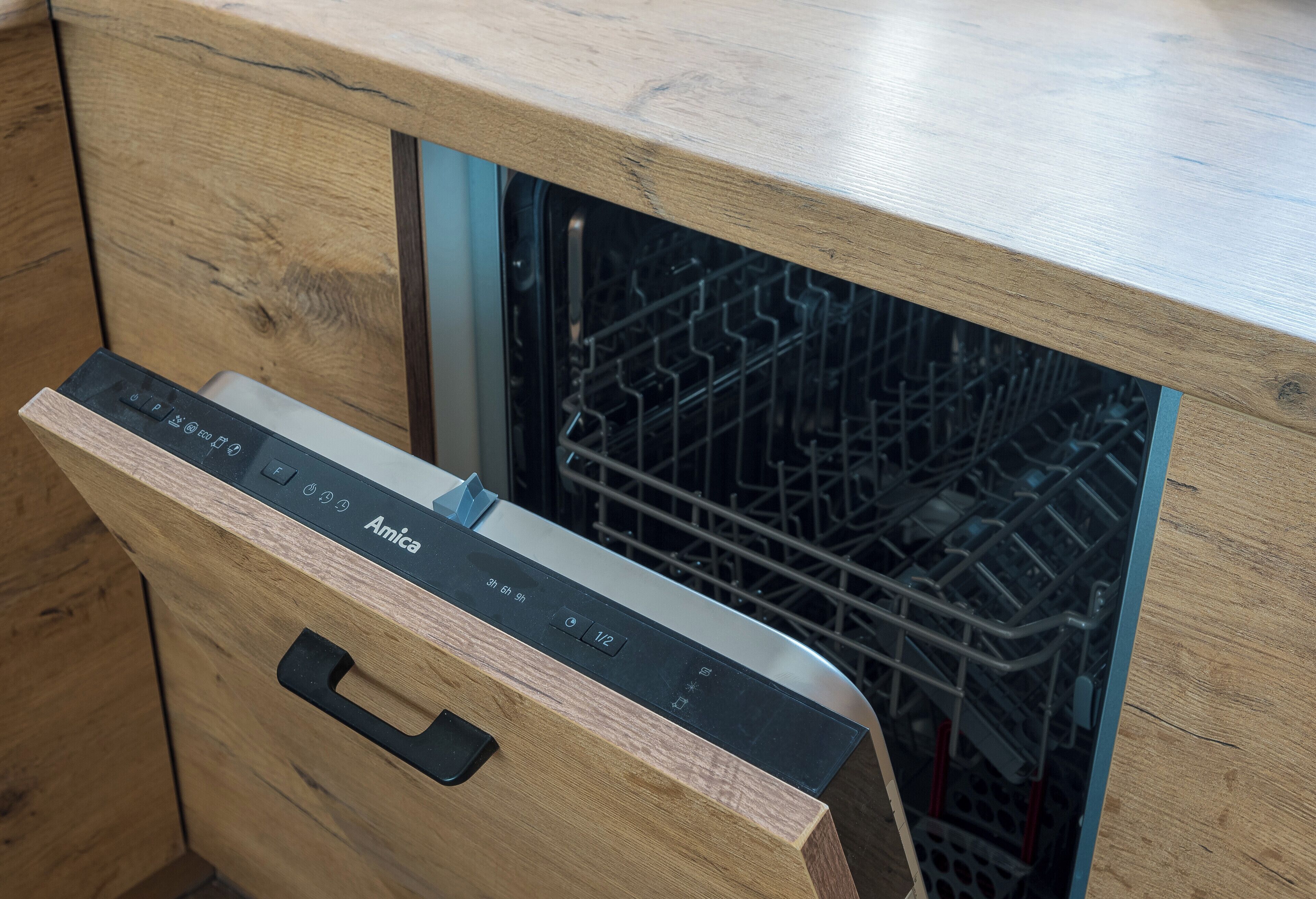 A wooden cabinet with a built-in dishwasher.