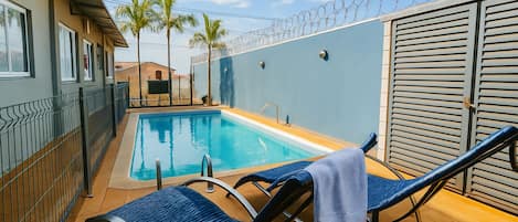 Outdoor pool, open 9:00 AM to 10:00 PM, sun loungers