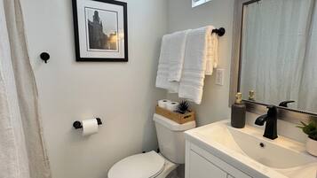 Shower, hair dryer, towels, soap