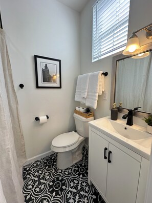 Shower, hair dryer, towels, soap