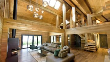 Deluxe Chalet, Mountain View | Living area | LED TV, fireplace, heated floors