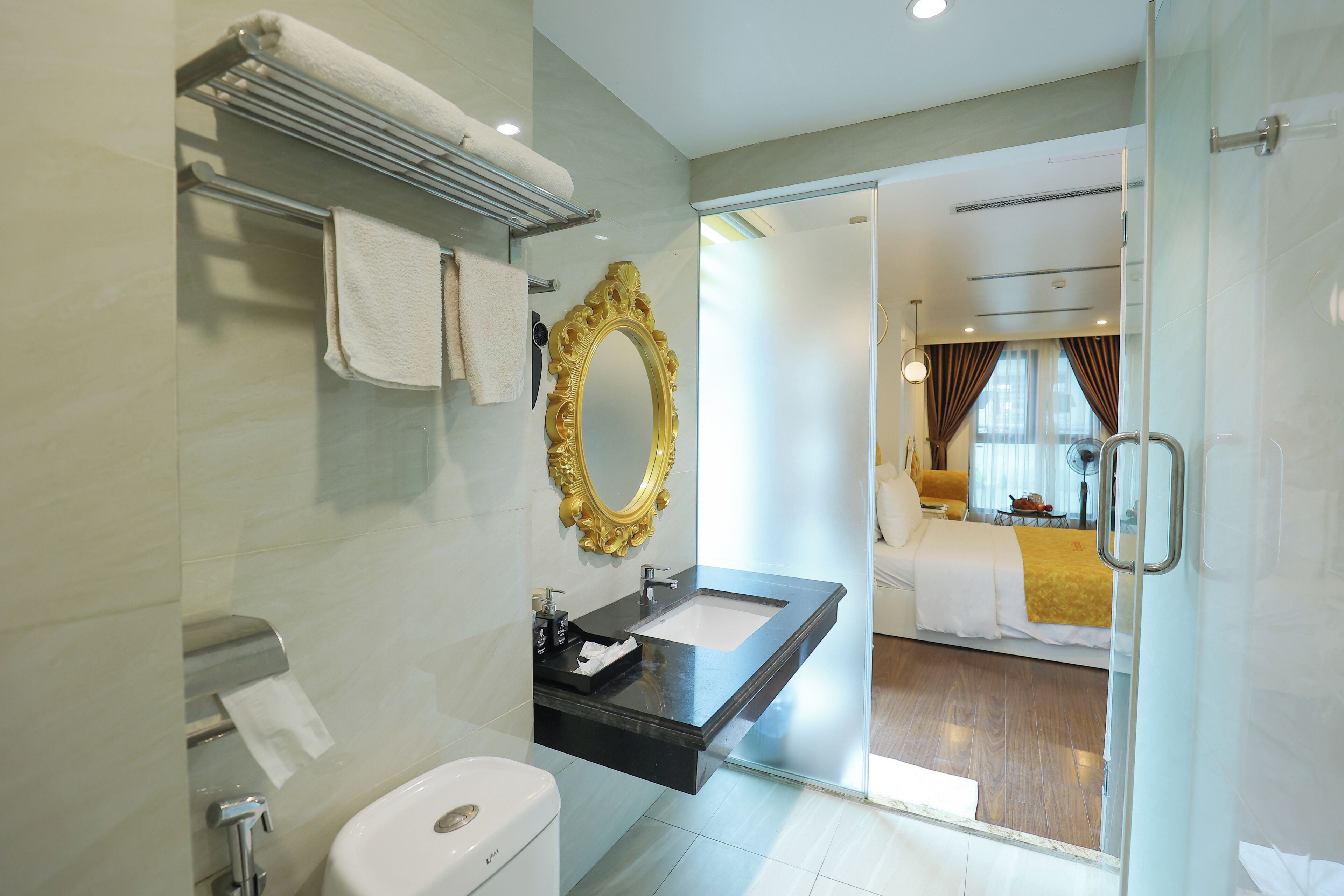 A modern bathroom with a vanity, sink, and toilet.