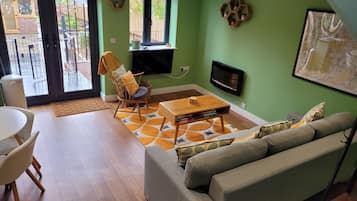 TV, fireplace, books