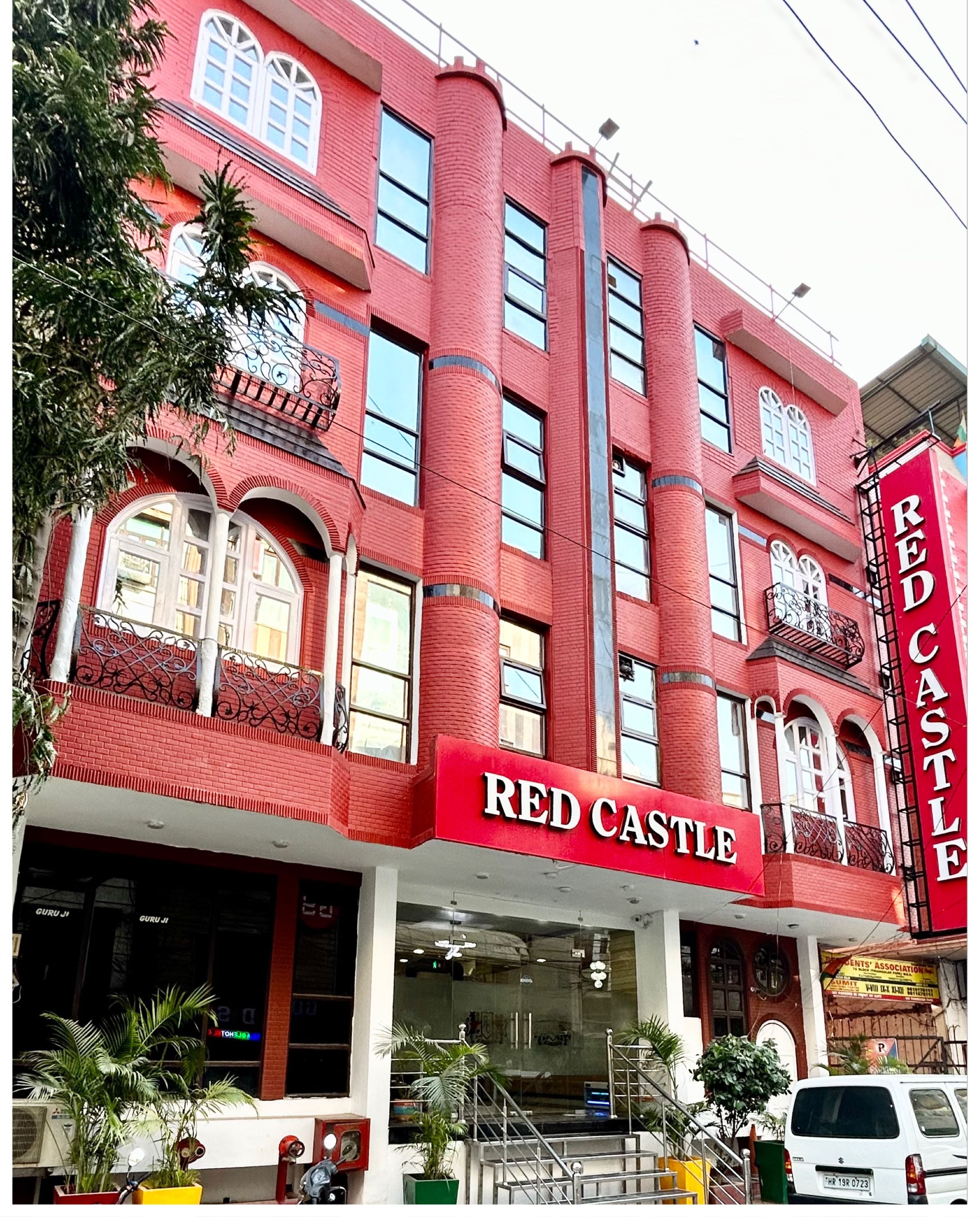 A red brick building with a sign reading "RED CASTLE."