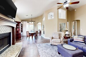 TV, fireplace - Dog-friendly house with firepit, game room, water view, fireplace-30 day stays (Litchfield Park)