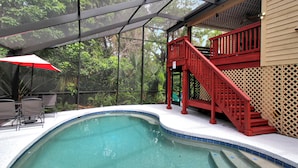 A swimming pool with a red staircase and a covered seating area. - Two Story Private Pool Home Near Bradenton Beach Bayside Paradise (Bradenton)