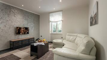 Family Apartment, 1 Bedroom, Microwave (Quiet City Apartment Dexa) | Living area | Smart TV