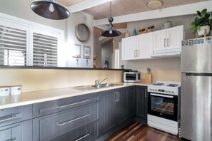 Coffee/tea maker, fridge, microwave, oven