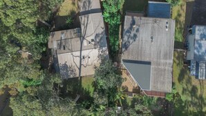 A residential area with multiple houses, each with a sloped roof and surrounded by greenery. - Secluded 3-Bed Retreat Moments to the Beach (Surf Beach)