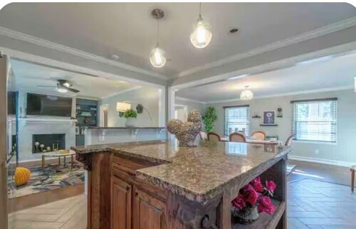  Freshly renovated four bedroom home with a Beautiful backyard and pond.  