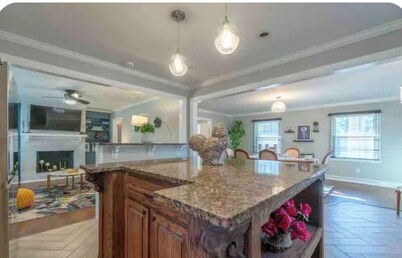 Freshly renovated four bedroom home with a Beautiful backyard and pond.