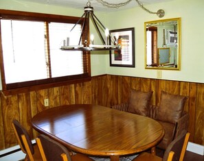 Enjoy meals in this cozy dining area with a large oval table and comfortable seating for four.