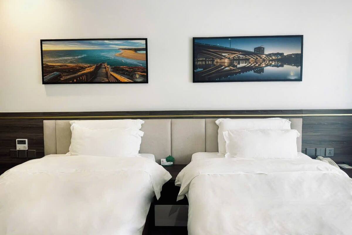 Habitación ejecutiva con 2 camas individuales | Cortinas opacas y sistema de insonorización