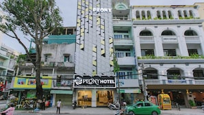 A hotel with a modern facade, multiple balconies, and a sign indicating it is a hotel. - Peony Hotel (Can Tho)