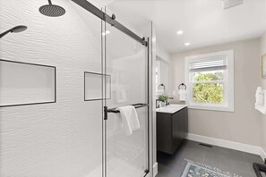 Shower, hair dryer, towels, shampoo