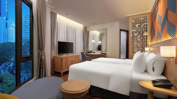 Premium bedding, pillow-top beds, free minibar items, blackout curtains