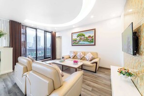 Appartement, 1 très grand lit et 1 canapé-lit, non-fumeurs, vue ville | Coin séjour | TV connectée, Netflix, films à la carte, services de streaming