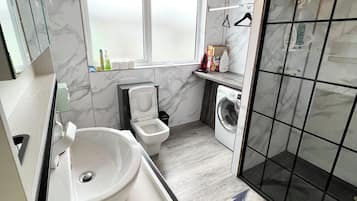 Shower, hair dryer, towels, soap