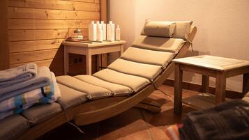 Relax in comfort with a reclining chair and a small table for your essentials.