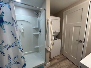 Shower, hair dryer, towels, soap