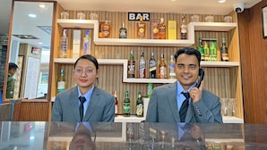 A bar area with shelves of various liquor bottles and glasses. - Hotel Lumbini Airport (Kathmandu)