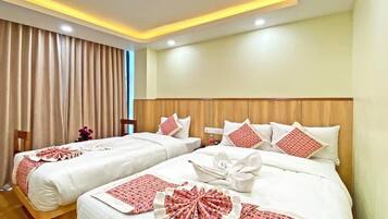 Habitación Deluxe con 1 cama matrimonial o 2 individuales | 1 habitación, ropa de cama de alta calidad y edredón