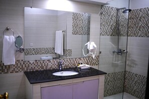 Rainfall showerhead, designer toiletries, hair dryer, slippers