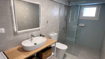 Shower, eco-friendly toiletries, towels, soap