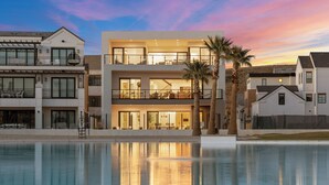 A modern two-story house with a pool in front. - Modern Lagoon: Desert Color Lagoon + Beaches (St. George)