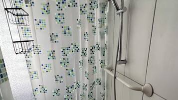 Shower, hair dryer, soap, toilet paper