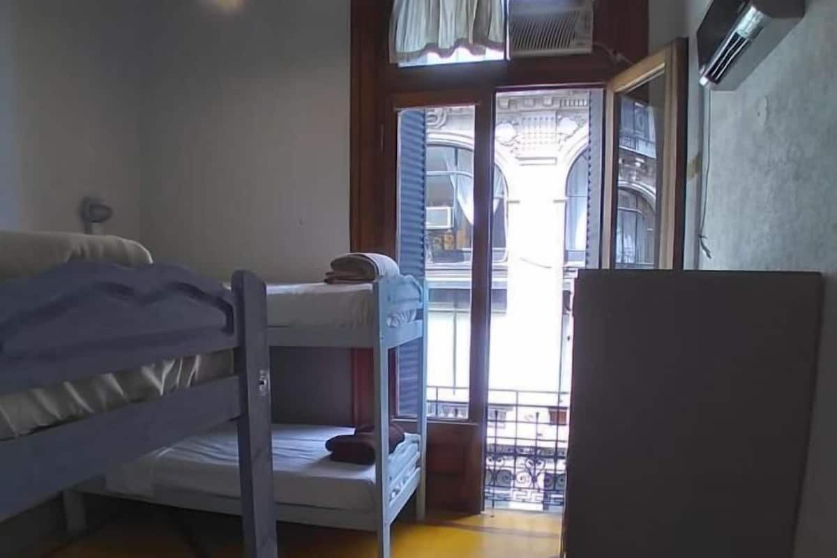 4 beds mixed dorm with bathroom and balcony